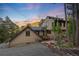 Charming two-story home with inviting curb appeal, lush landscaping, and a picturesque setting at 1298 Meadow View Dr, Evergreen, CO 80439