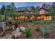 Home's exterior showcasing professionally landscaped yard and stylish balconies at 1298 Meadow View Dr, Evergreen, CO 80439