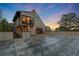 Home exterior featuring a large patio area, ideal for outdoor entertaining and enjoying the scenic views at 1298 Meadow View Dr, Evergreen, CO 80439