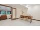 Bright office space with an accent table, natural light, and access to a comfortable living room at 1298 Meadow View Dr, Evergreen, CO 80439