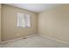 Neutral bedroom with carpeted floors and a window at 9860 Burberry Way, Highlands Ranch, CO 80129