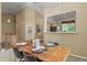 Elegant dining area with a view to the kitchen and stylish decor at 9860 Burberry Way, Highlands Ranch, CO 80129