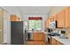 Well-equipped kitchen with stainless steel appliances and ample cabinet space at 9860 Burberry Way, Highlands Ranch, CO 80129
