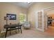 Functional home office featuring a desk, comfortable chair, and ample natural light at 9860 Burberry Way, Highlands Ranch, CO 80129