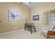 Well-lit home office with comfortable seating and a serene atmosphere at 9860 Burberry Way, Highlands Ranch, CO 80129