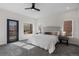 Bright bedroom showcasing gray carpet, natural light, and door to outdoor balcony at 3285 Lawrence St, Denver, CO 80205