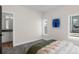 Bright bedroom featuring soft carpet, white walls, and ensuite bathroom with modern fixtures at 3285 Lawrence St, Denver, CO 80205