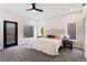 Relaxing bedroom with a ceiling fan, carpet, and neutral colors creating a serene atmosphere at 3285 Lawrence St, Denver, CO 80205
