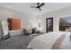 Spacious primary bedroom filled with natural light featuring comfortable sitting area at 3285 Lawrence St, Denver, CO 80205
