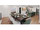 Contemporary dining room with an adjacent open-concept kitchen and seating for at least eight at 3285 Lawrence St, Denver, CO 80205