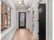 Inviting entryway with modern lighting, sleek door, and view of the exterior at 3285 Lawrence St, Denver, CO 80205