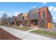 Modern townhomes showcasing clean lines and attractive exterior design with vertical slat accents at 3285 Lawrence St, Denver, CO 80205