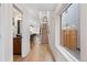 Spacious hallway with modern staircase and large window, providing ample natural light at 3285 Lawrence St, Denver, CO 80205