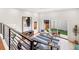 Open-concept living room featuring a modern area rug, stylish furniture, and sliding glass doors to the backyard at 3285 Lawrence St, Denver, CO 80205