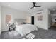 Bright main bedroom features a ceiling fan, modern design, and light gray carpeted floors at 3285 Lawrence St, Denver, CO 80205