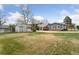 Spacious backyard showcasing a shed, trees, and grass at 4595 S Fox St, Englewood, CO 80110