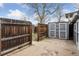 Backyard featuring fenced in area and a gray shed at 4595 S Fox St, Englewood, CO 80110