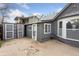 Backyard featuring shed, concrete area, and a view of the back of the house at 4595 S Fox St, Englewood, CO 80110