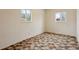 Bedroom with carpet flooring, two windows, and neutral walls at 4595 S Fox St, Englewood, CO 80110