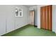Bedroom featuring a window, closet, neutral walls, and green carpet flooring at 4595 S Fox St, Englewood, CO 80110
