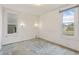 Bright bedroom with two windows and neutral carpet at 4595 S Fox St, Englewood, CO 80110