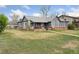 Exterior of a home with brick foundation and lush green lawn at 4595 S Fox St, Englewood, CO 80110