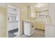 Cozy kitchen featuring a white stove and an open doorway to another room at 4595 S Fox St, Englewood, CO 80110