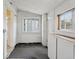 Open mud room featuring built in storage and black and white trim at 4595 S Fox St, Englewood, CO 80110