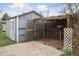Storage shed featuring a lattice covered area and concrete patio at 4595 S Fox St, Englewood, CO 80110