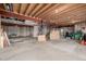 Unfinished basement with exposed beams and concrete floor is ready for your personalization at 9275 Erminedale Dr, Lone Tree, CO 80124