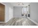 Bedroom with wood-style floors and natural light from the windows at 9275 Erminedale Dr, Lone Tree, CO 80124