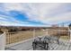 Relax on this deck with neighborhood views and a table with chairs at 9275 Erminedale Dr, Lone Tree, CO 80124