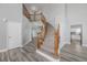 Grand entrance with staircase, hardwood floors, and modern barn door at 9275 Erminedale Dr, Lone Tree, CO 80124