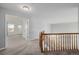 Hallway featuring a wooden banister and staircase at 9275 Erminedale Dr, Lone Tree, CO 80124