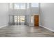 Bright living room with tall ceilings, hardwood floors, and many windows for natural light at 9275 Erminedale Dr, Lone Tree, CO 80124