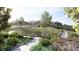 Scenic community park with walking paths, green spaces, and lush landscaping for outdoor enjoyment and recreation at 17137 W 91St Ln, Arvada, CO 80007