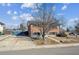 Charming two-story brick home with blue shutters and a well-maintained front yard at 11782 Gilpin St, Northglenn, CO 80233