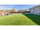 Large backyard with grassy area and patio at 1040 S Fulton Ave, Fort Lupton, CO 80621