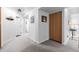 Basement hallway with carpet, neutral walls, and access to other rooms at 1040 S Fulton Ave, Fort Lupton, CO 80621