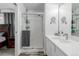 Bathroom with walk-in shower and white vanity at 1040 S Fulton Ave, Fort Lupton, CO 80621