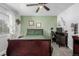 Cozy bedroom with a double bed and home office area at 1040 S Fulton Ave, Fort Lupton, CO 80621