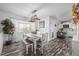 Farmhouse-style dining room with a wooden table and chandelier at 1040 S Fulton Ave, Fort Lupton, CO 80621