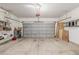 Garage with overhead door and space for storage and workbenches at 1040 S Fulton Ave, Fort Lupton, CO 80621