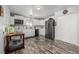 Modern kitchen with white cabinets and stainless steel appliances at 1040 S Fulton Ave, Fort Lupton, CO 80621