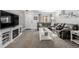 Living room featuring a gray sectional sofa and a built-in fireplace at 1040 S Fulton Ave, Fort Lupton, CO 80621