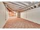 Spacious unfinished basement with exposed ductwork and lighting fixtures and one small window at 9183 W Cedar Dr # 2, Lakewood, CO 80226