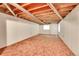 Unfinished basement with carpet and white painted walls at 9183 W Cedar Dr # 2, Lakewood, CO 80226