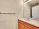 Bathroom with vanity, mirror, cabinet, and sink with tile countertop at 9183 W Cedar Dr # 2, Lakewood, CO 80226