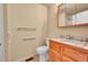 Neutral bathroom featuring a ceramic tiled countertop, neutral walls, and handicap bars in the shower at 9183 W Cedar Dr # 2, Lakewood, CO 80226