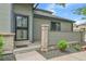 Townhome front entrance with a security gate and decorative brick pillar at 9183 W Cedar Dr # 2, Lakewood, CO 80226